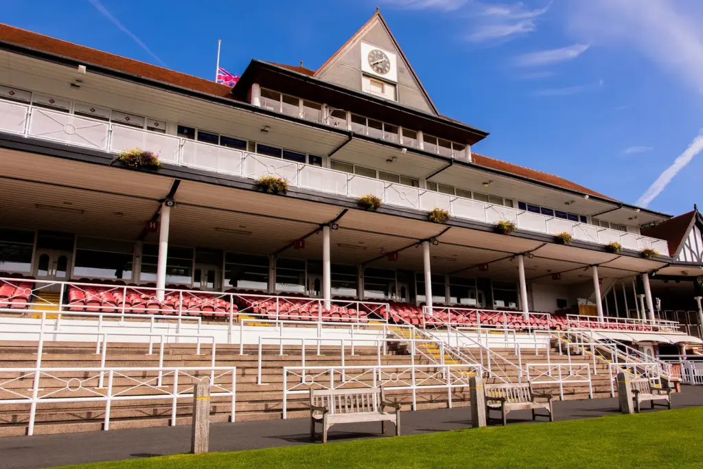 The County Stand grandstand at Chester Racecourse with its clock gable and tiered seating